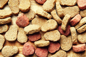 The image of dog food on a wooden table