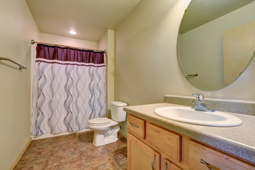 Bathroom interior with colorful shower curtain