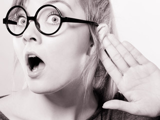 Shocked girl eavesdropping.
