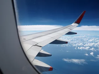 Fototapeten Looking through window aircraft during flight © decnui