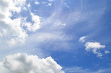 Blue sky with white fluffy clouds