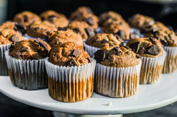 Close up photo of chocolate chip muffins at a street food market. Selective focus
