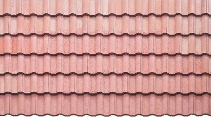 Close up of bright red tile roof surface, abstract background texture