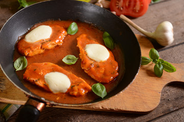 Chciken breast with tomato sauce and melted mozarella cheese