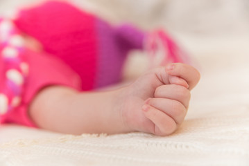 Obraz na płótnie Canvas Close-up photo of newborn baby hand
