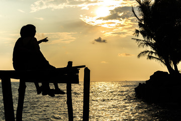 Silhouettes at sunset on the beach