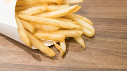Selective focus on the front french fries on table