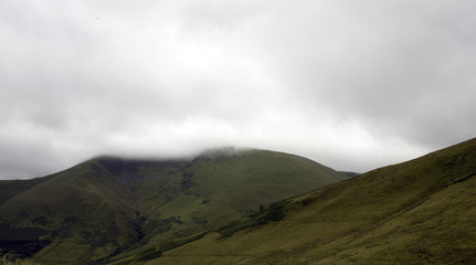 Fototapeta na wymiar Mist Coming Off a Mountain Top