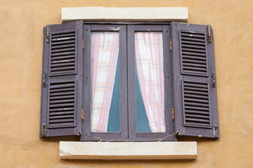 Old wood window on concrete wall 