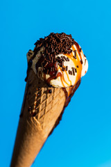 Vanilla ice cream isolated on blue background