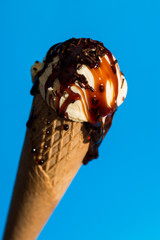 Vanilla ice cream isolated on blue background