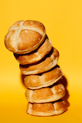Fresh buns on yellow background
