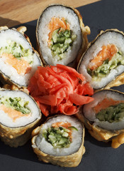 Sushi over black background