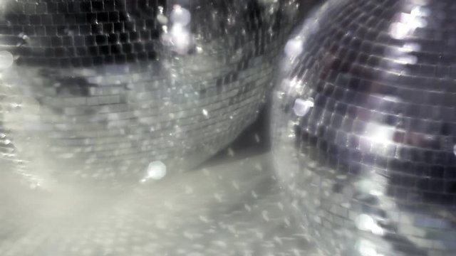 funky glitterball spinning with patterns of light