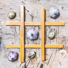 Tic Tac Toe with garlic and eggs