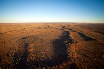 Aerial View of Desert Outback Australia at Sunset (near Ayres Rock - Uluru)