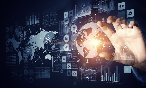 Businessman using innovative technologies . Mixed media