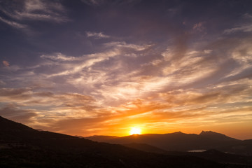Dramatic sunset sky over Sant' Antonino in Corsica