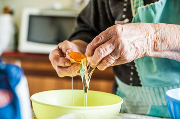 old italian lady's hands making home made italian pasta