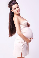 Portrait of the young happy smiling pregnant woman