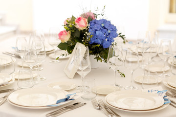 Sparkling glassware stands on the white dinner table