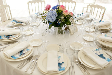 Look from above on the round dinner table  served for a festive