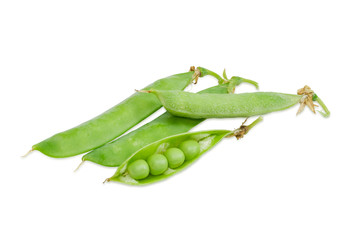 Several pods of green peas on a light background