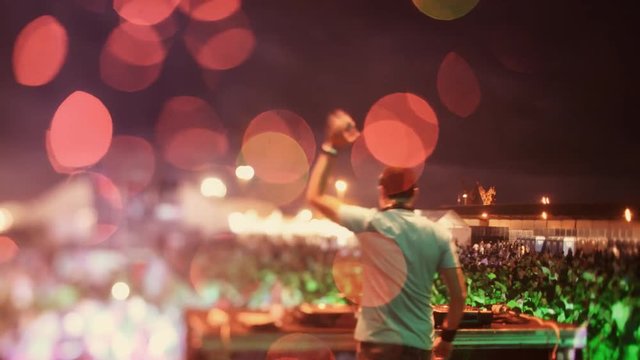dj looking the crowd at a festival