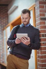 Mature student using digital tablet