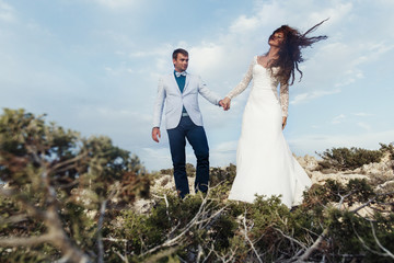 Man admires a woman while she shakes her hair on the wind