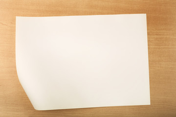 White paper with fold inside corner on wood background, Blank paper