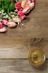 Glass of white wine and flowers