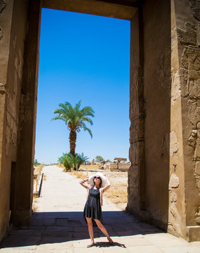 Young woman enjoying sunlight and travel Egypt. Positive thinking concept