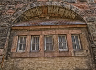 Fototapeta na wymiar window castle brown and old