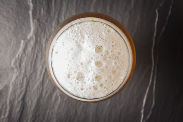 Glass beer on stone background with copy space. wallpaper