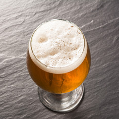 Glass beer on stone background with copy space. wallpaper