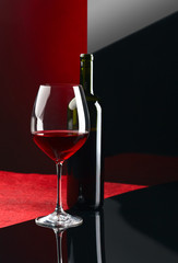  bottle and glass with red wine