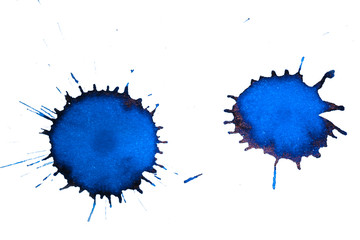 Two blue ink splahes on paper