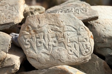 Buddhist symbols on Mani Wall in Manang Valley, Annapurna Circuit, Manang, Nepal