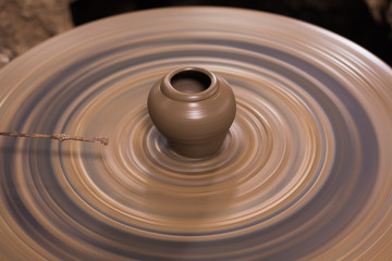 Fototapeta na wymiar A pot on a turntable, earthenware
