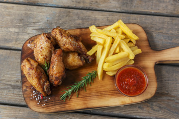 fried chicken wings french fries and sauce