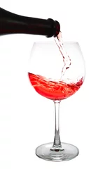 Fotobehang red wine pouring  isolated © onairjiw