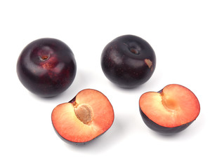 Plum with  sliced plum  on a white background.