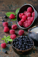 Bowls of raspberries and blueberries