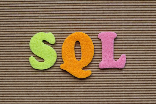 SQL (Structured Query Language) acronym on cardboard background