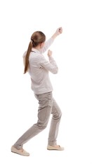 back view of standing girl pulling a rope from the top or cling to something. girl  watching. Rear view people collection.  backside view of person.  Isolated over white background. Girl with long