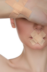 face of beautiful european woman with medical patch