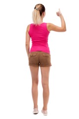Back view of  woman thumbs up. Rear view people collection. backside view of person. Isolated over white background. Blonde in brown shorts showing a thumbs up with his left hand.