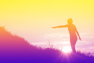 Silhouette of woman So happy at sunset