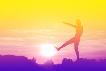 Silhouette of woman So happy at sunset